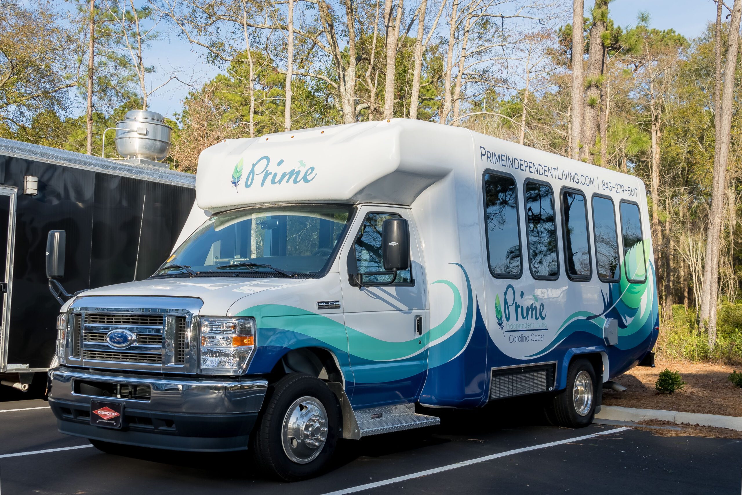 Prime Carolina Coast's bus sits in the parking lot, ready for adventure